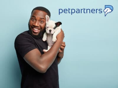 PetPartners pet insurance review featuring a man holding a puppy